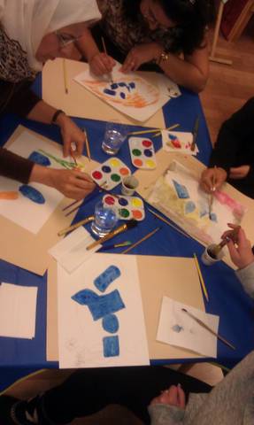 Participants painting a masterpiece. They really encouraged each other.